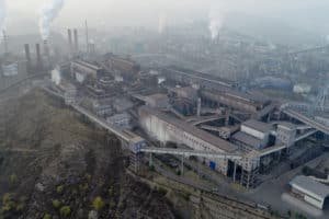 Aerial view of big factory in China.Air pollution by smoke coming out of chimneys. Coal Fossil Fuel Power Plant Smokestacks Emit Carbon Dioxide Pollution. Chengde, China. 10/22/2018