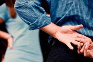 Man removing wedding ring