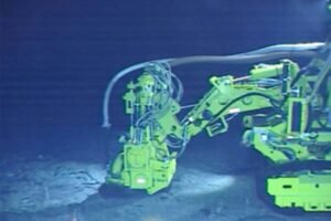 A green robot arm