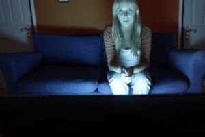 Lonely woman watching tv
