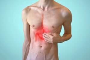 Man's body, highlighting the stomach and esophagus