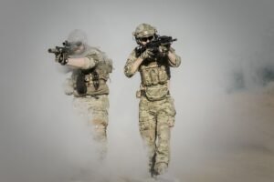 Soldiers pointing guns