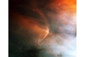 Infrared image of the shockwave (red arc) created by the massive giant star Zeta Ophiuchi in an interstellar dust cloud. The tenuous winds of sun-like main-sequence stars are much more difficult to observe