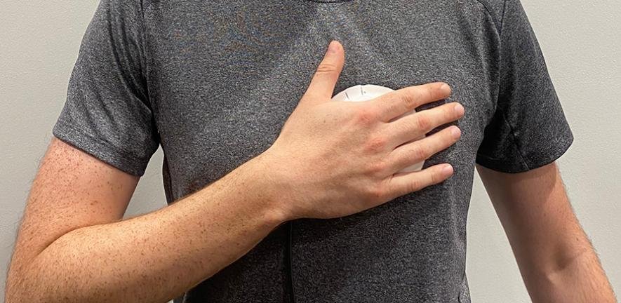 Person demonstrating use of a handheld device for heart disease screening Credit: Acoustics Lab
